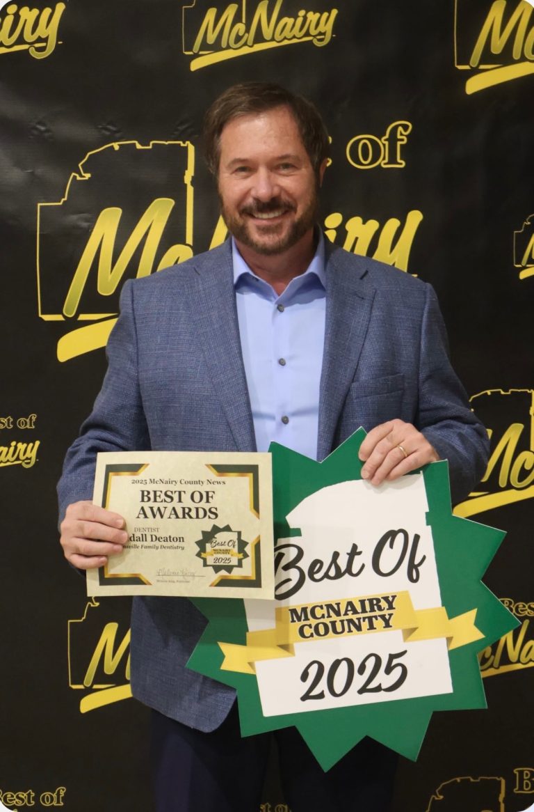Dr. Randall Deaton holding Best Dentist award and Best of McNairy County 2025 sign at the Best of McNairy County awards ceremony